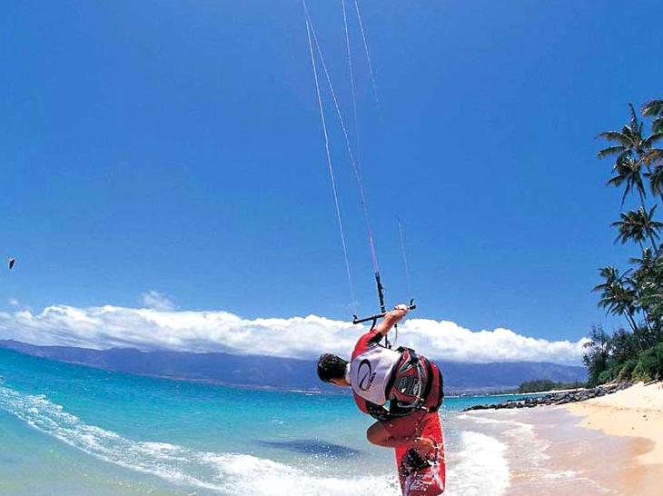 Kiteboarding Courses: Practicing kiteboarding on the water surface.